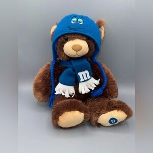 M&M's World brown bear plush stuffed animals with blue hats and scarves.